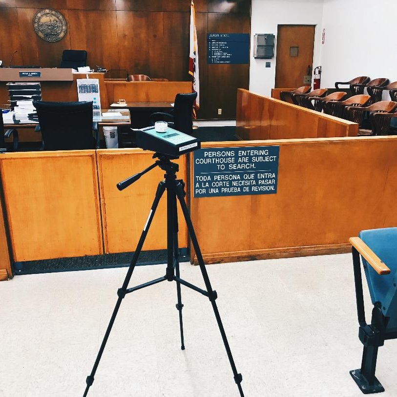 Air sampling pump set up in a courtroom during an indoor air quality assessment