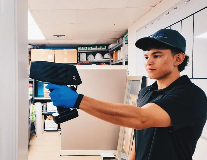 TERRA technician using an XRF analyzer during a lead paint survey